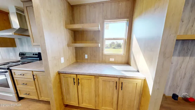 a view of a kitchen from the closet