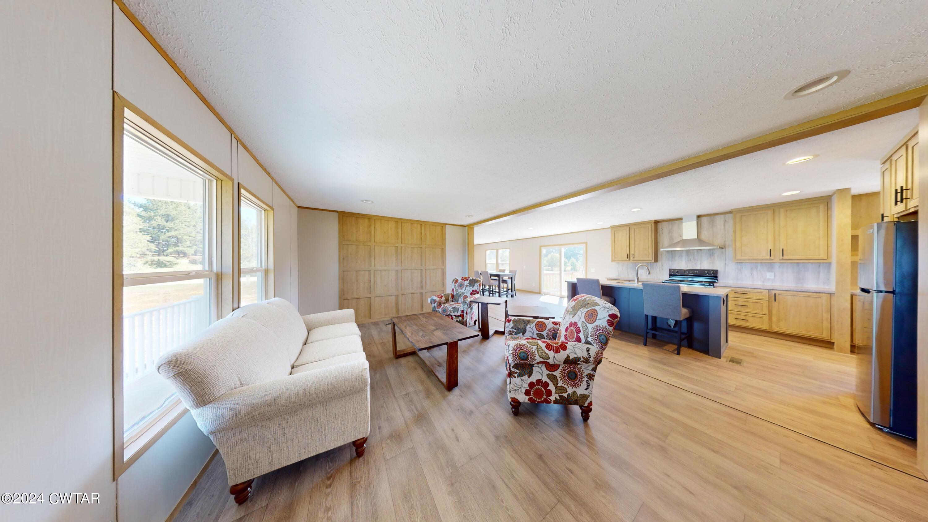 463 Peckerwood Point Road Newbern, TN 38059 - Photo 2 of 35 a living room with furniture and wooden floor