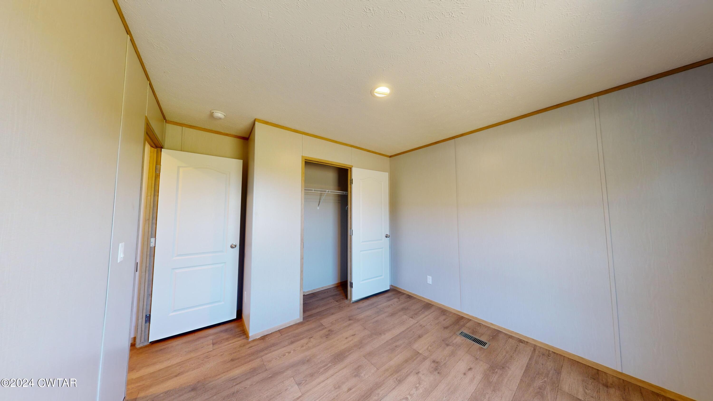 463 Peckerwood Point Road Newbern, TN 38059 - Photo 30 of 35 a view of hallway with wooden floor