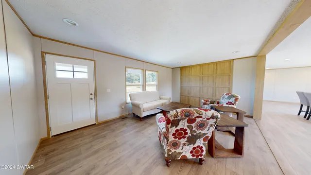 a bedroom with furniture and a window