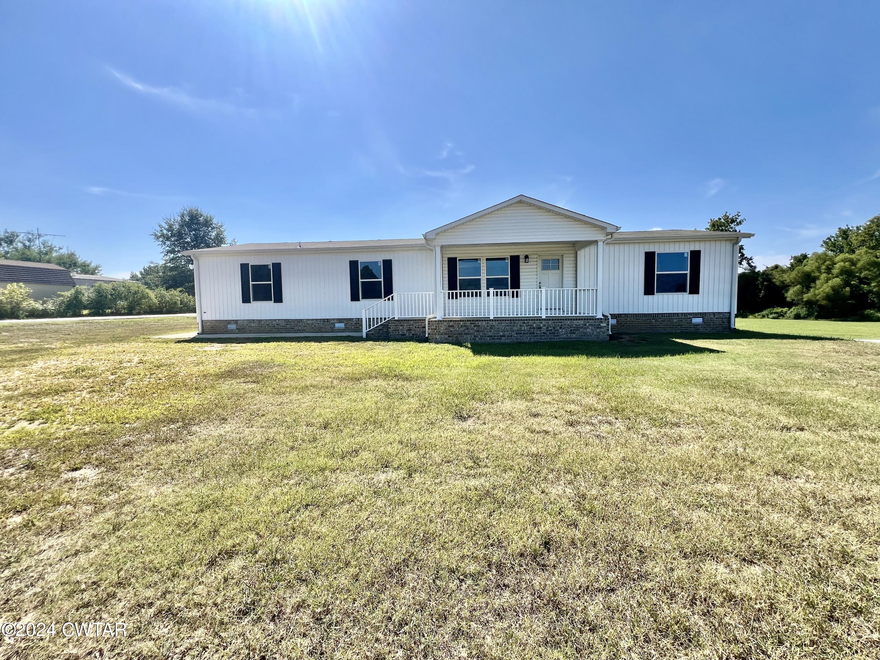 463 Peckerwood Point Road Newbern, TN 38059 - Photo 33 of 35 a house view with a outdoor space