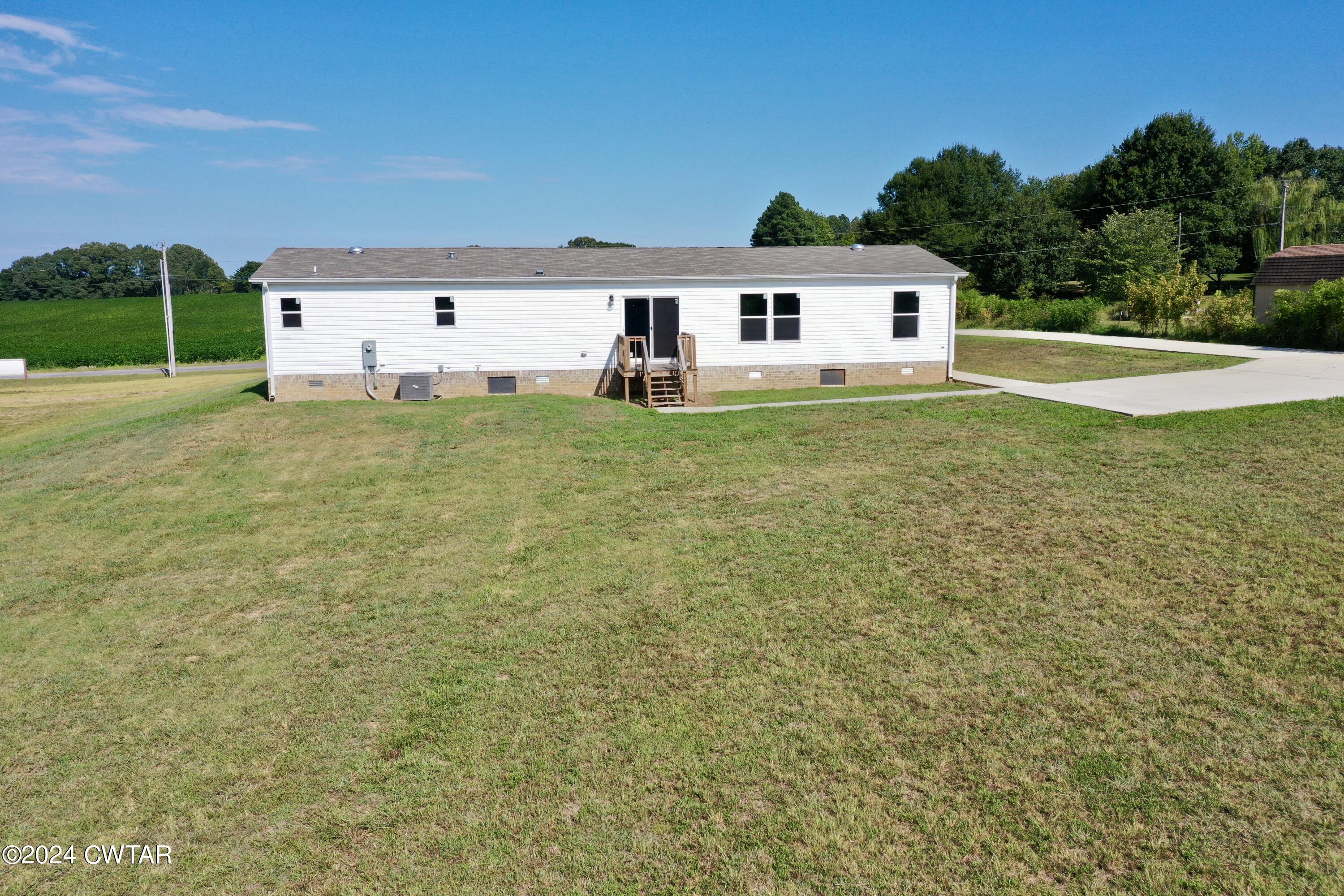 463 Peckerwood Point Road Newbern, TN 38059 - Photo 34 of 35 a front view of a house with garden