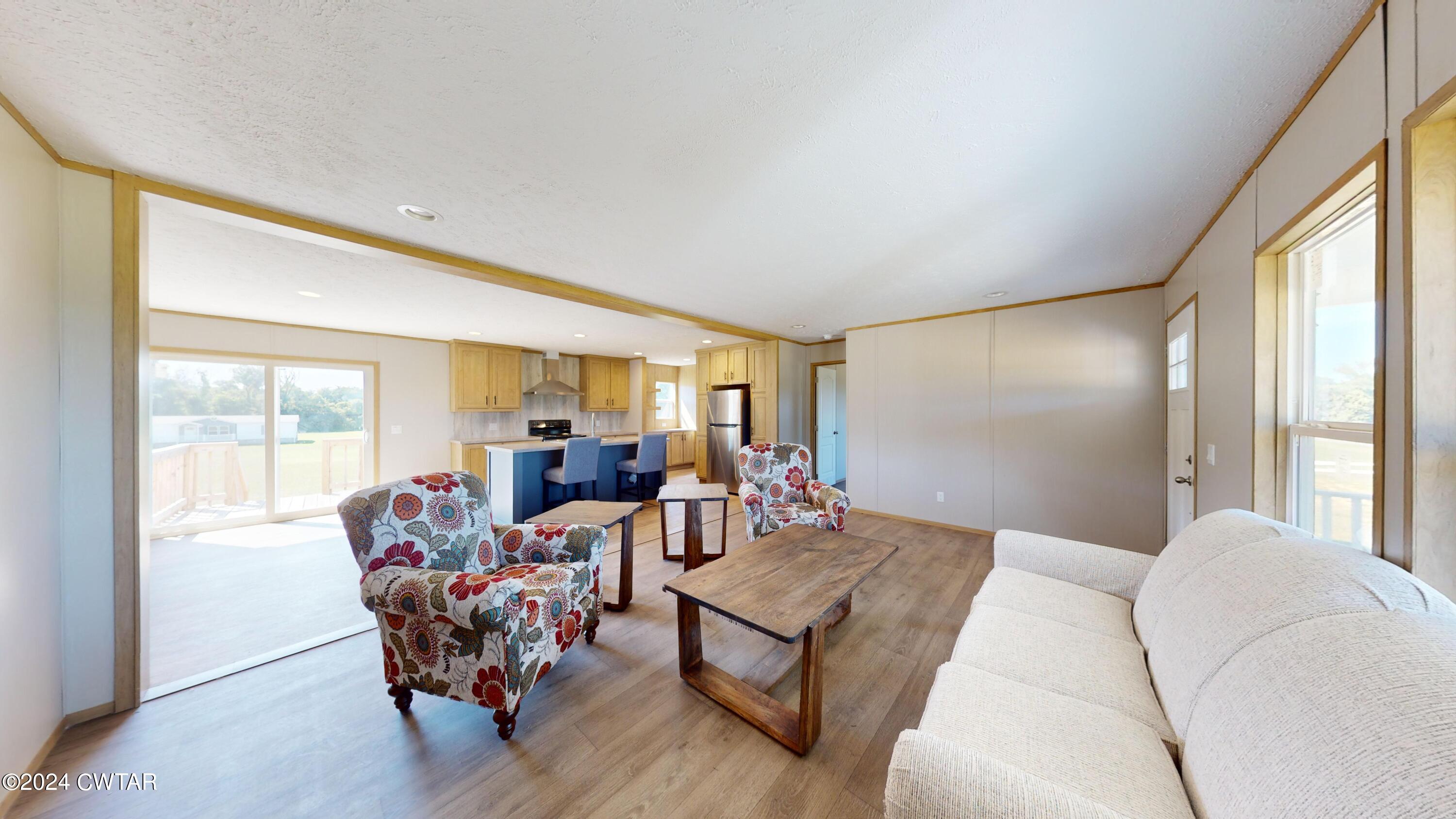 463 Peckerwood Point Road Newbern, TN 38059 - Photo 4 of 35 a living room with furniture and a large window