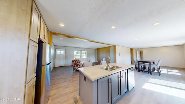 a view of a living room and a wooden floor