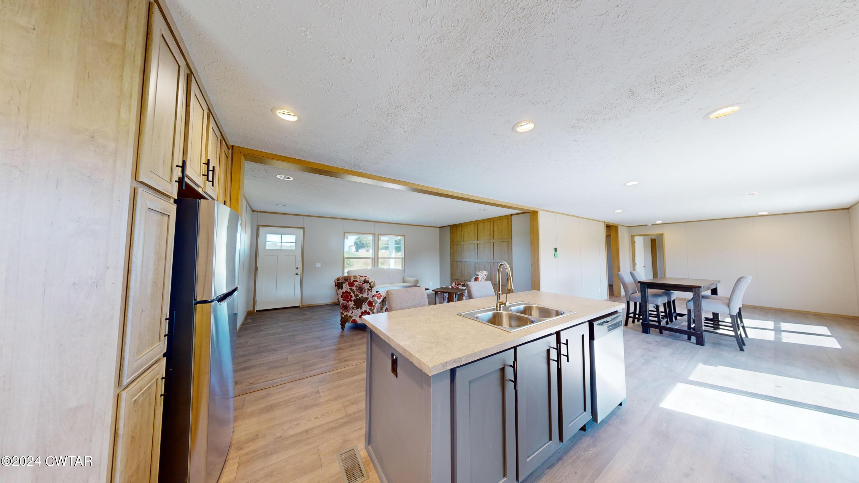 463 Peckerwood Point Road Newbern, TN 38059 - Photo 8 of 35 a view of a living room and a wooden floor