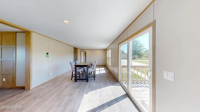 a view of a livingroom with furniture and wooden floor