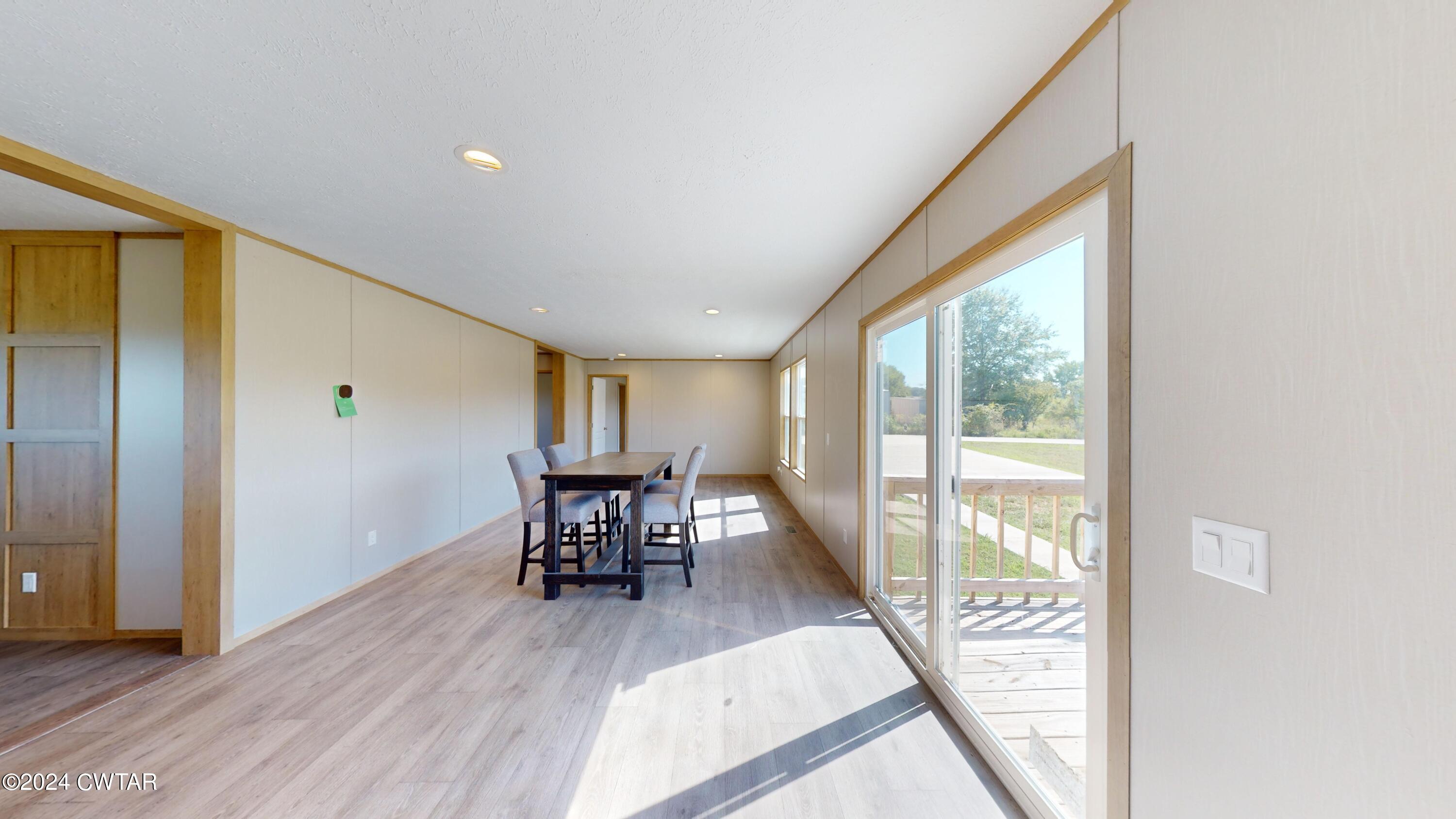 463 Peckerwood Point Road Newbern, TN 38059 - Photo 9 of 35 a view of a livingroom with furniture and wooden floor