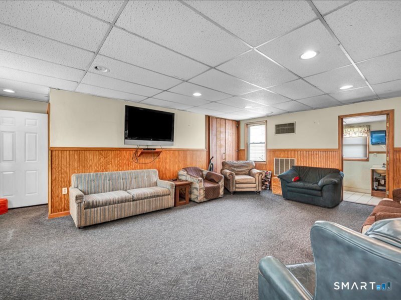 61 Maple Avenue Wallingford, CT 06492 - Photo 12 of 20 a living room with furniture and a flat screen tv
