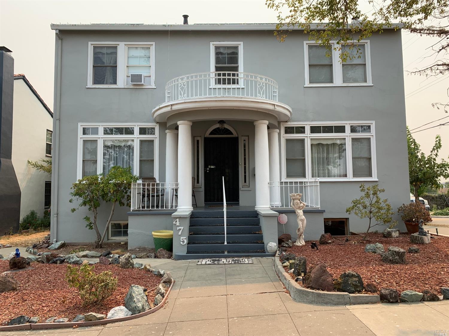 475 South Front Street Rio Vista, CA 94571 - Photo 1 of 1 a front view of a house with plants
