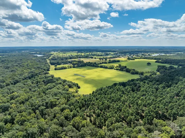 a view of a swimming pool with an outdoor seating and yard