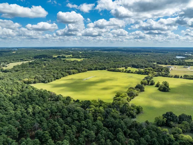 a view of a lake with a yard