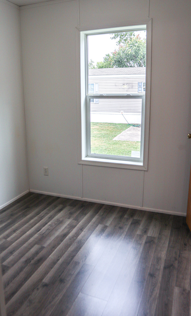 6 Countryside Estates Sandwich, IL 60548 - Photo 16 of 26 an empty room with wooden floor and windows