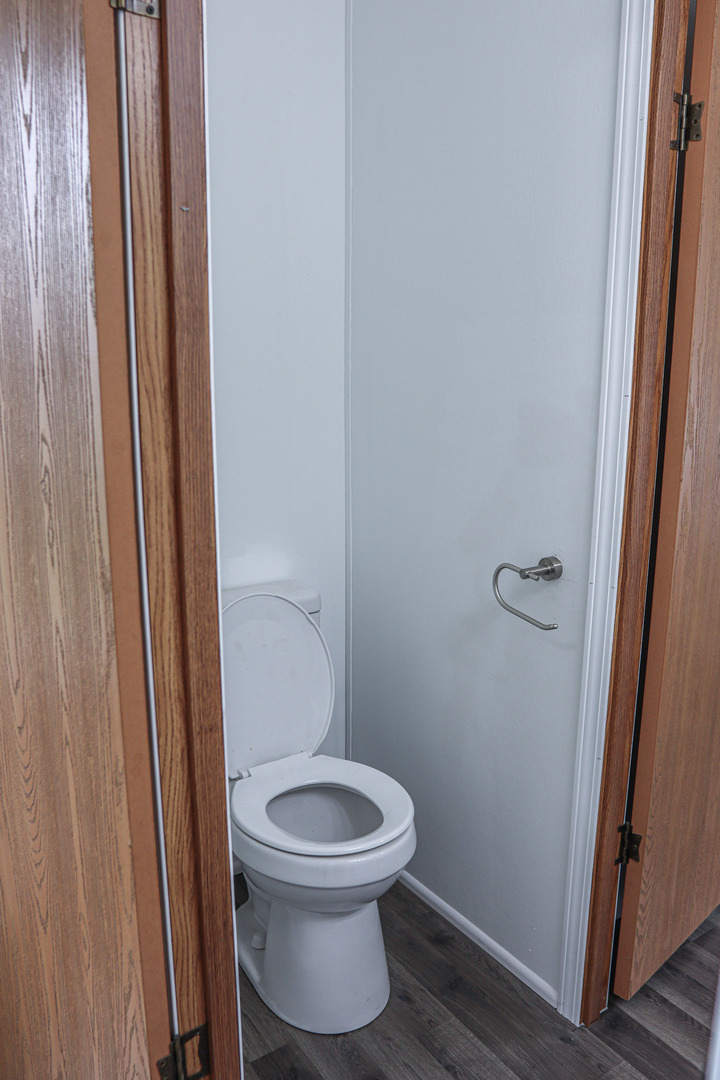 6 Countryside Estates Sandwich, IL 60548 - Photo 18 of 26 a white toilet sitting next to a small bathroom