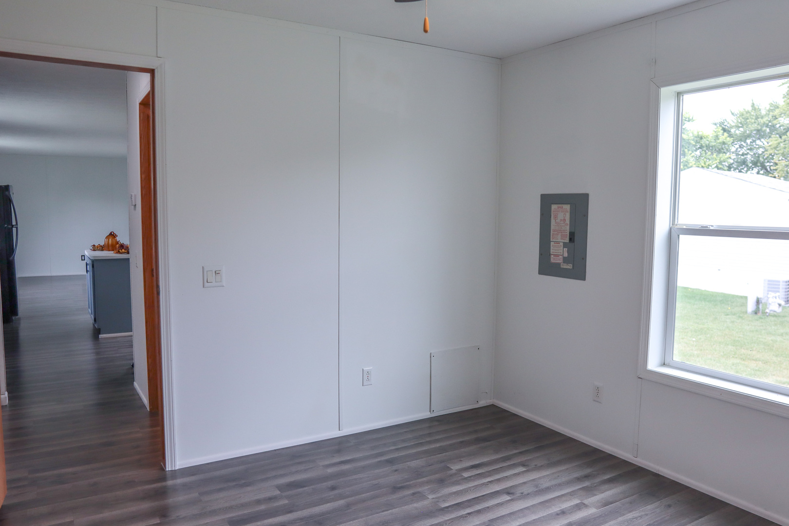 6 Countryside Estates Sandwich, IL 60548 - Photo 24 of 26 an empty room with wooden floor and windows