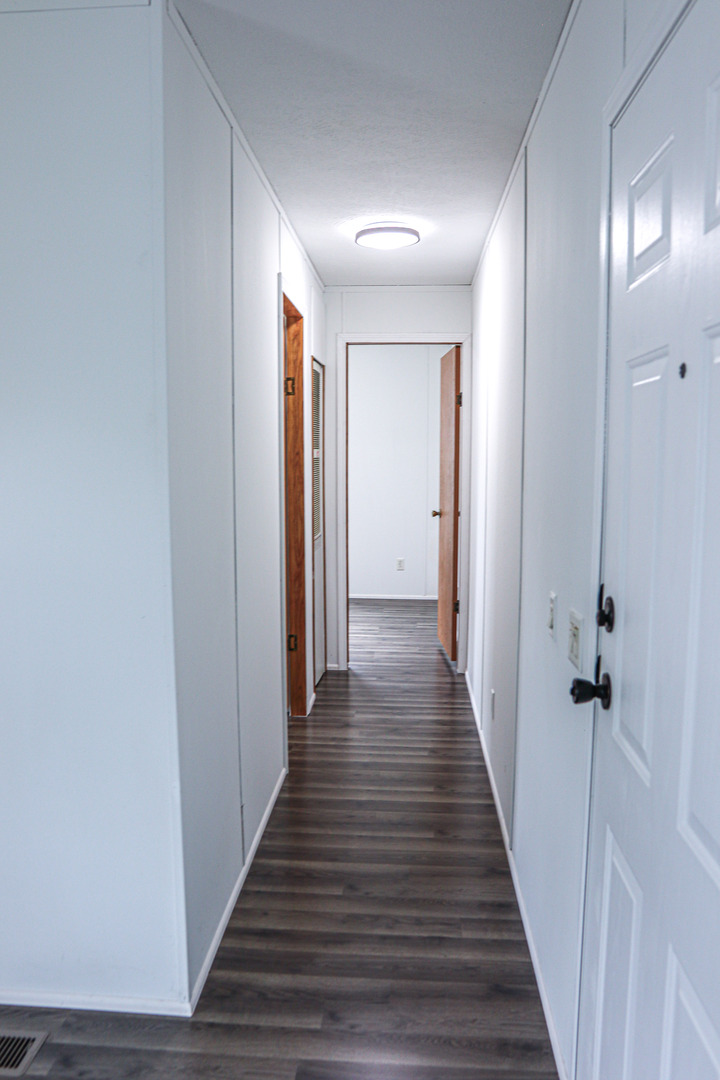 6 Countryside Estates Sandwich, IL 60548 - Photo 9 of 26 a view of a hallway with the wooden floor