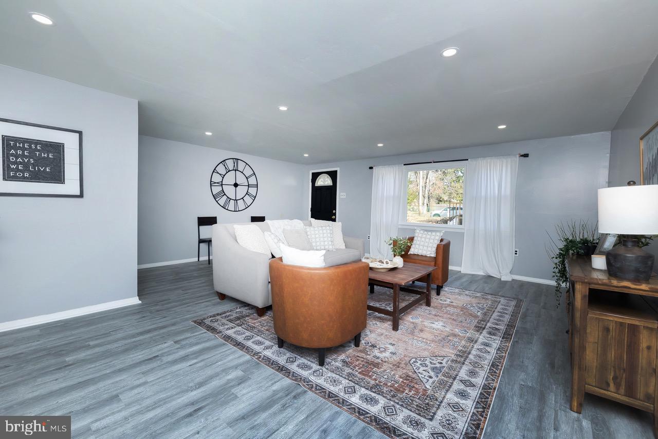112 East 7th Avenue Pine Hill, NJ 08021 - Photo 16 of 27 a living room with furniture and a wooden floor