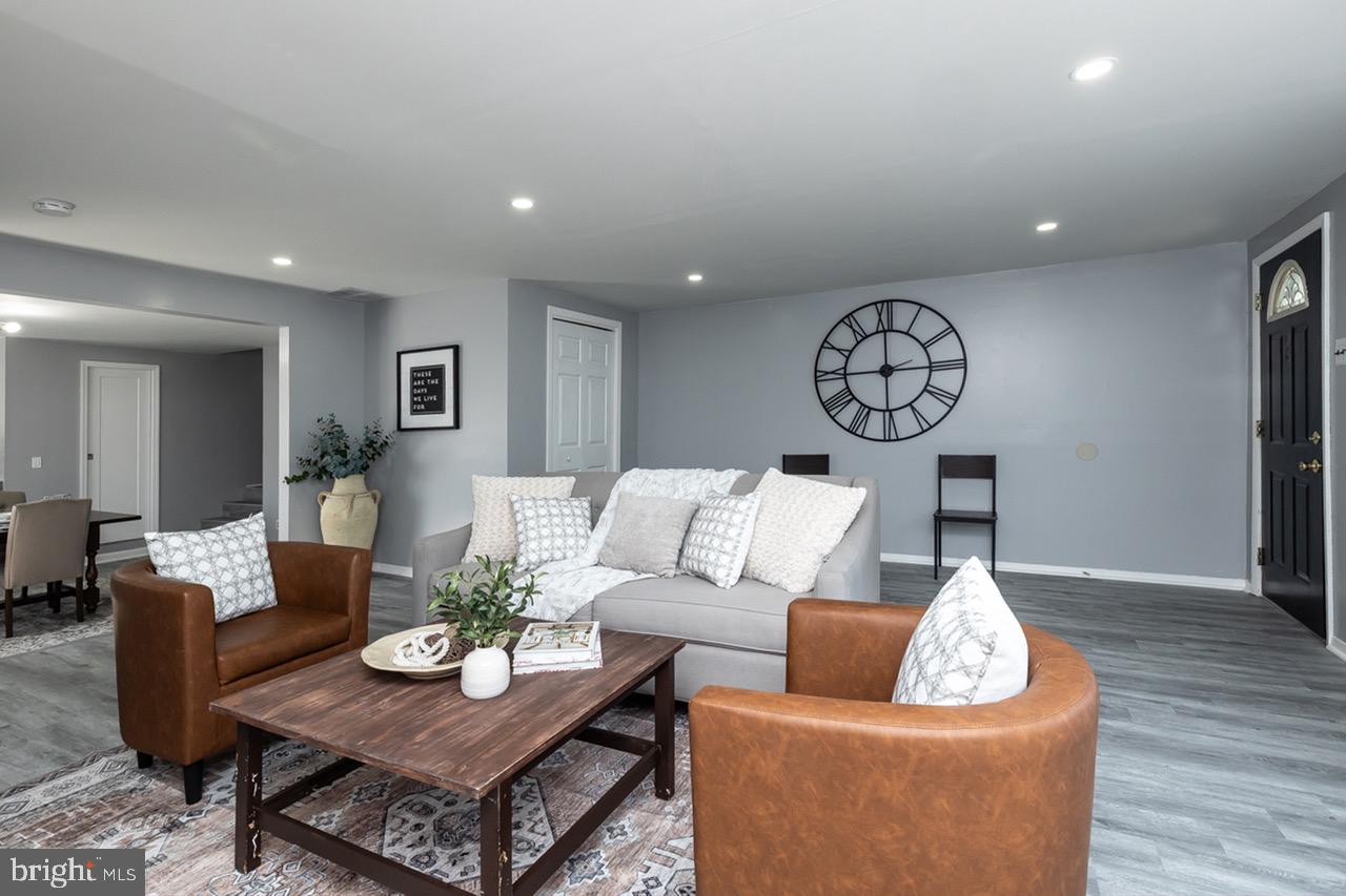 112 East 7th Avenue Pine Hill, NJ 08021 - Photo 18 of 27 a living room with furniture and wooden floor