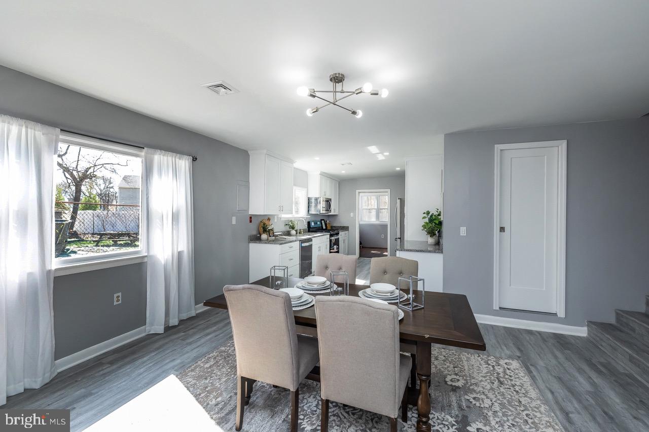 112 East 7th Avenue Pine Hill, NJ 08021 - Photo 20 of 27 a view of a dining room with furniture window and wooden floor