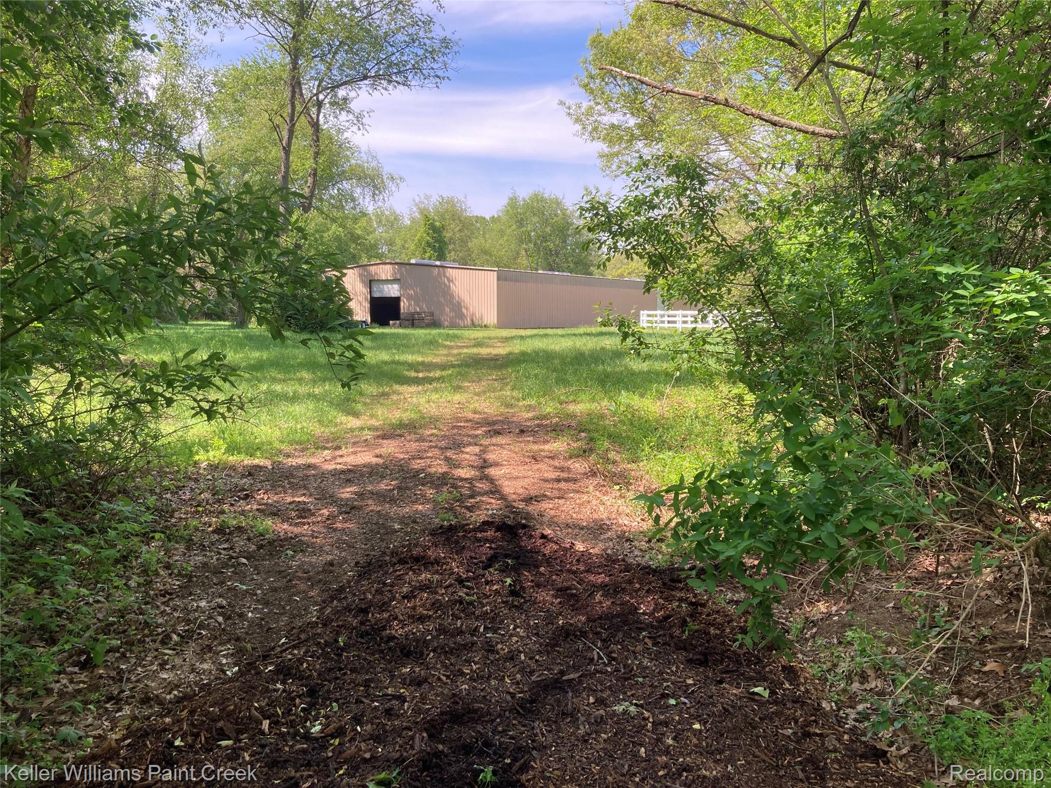 42891 Bemis Road Belleville, MI 48111 - Photo 35 of 51 View towards the indoor arena from trails.