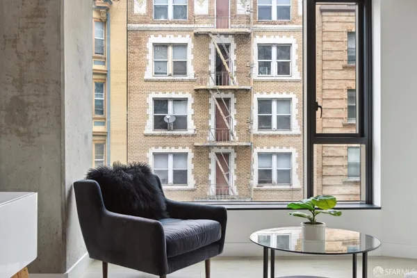 a living room with furniture and windows