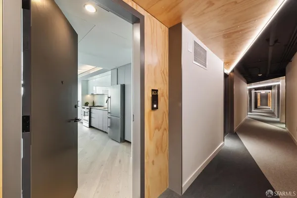 a view of a kitchen from the hallway