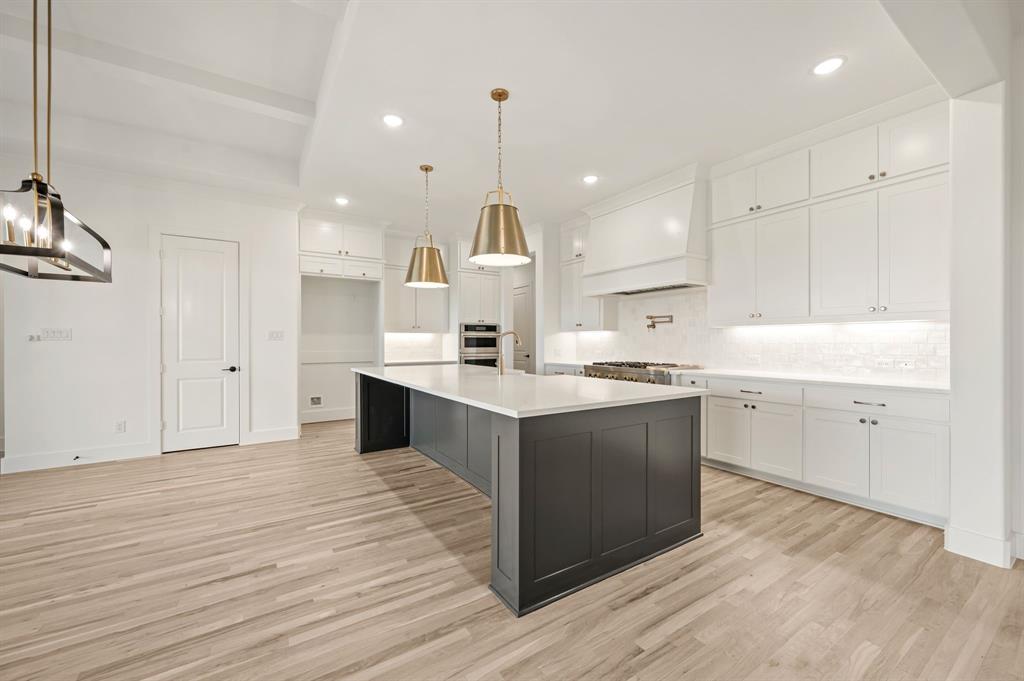 2139 Kingston Street Haslet, TX 76052 - Photo 12 of 40 a kitchen with a sink window and cabinets