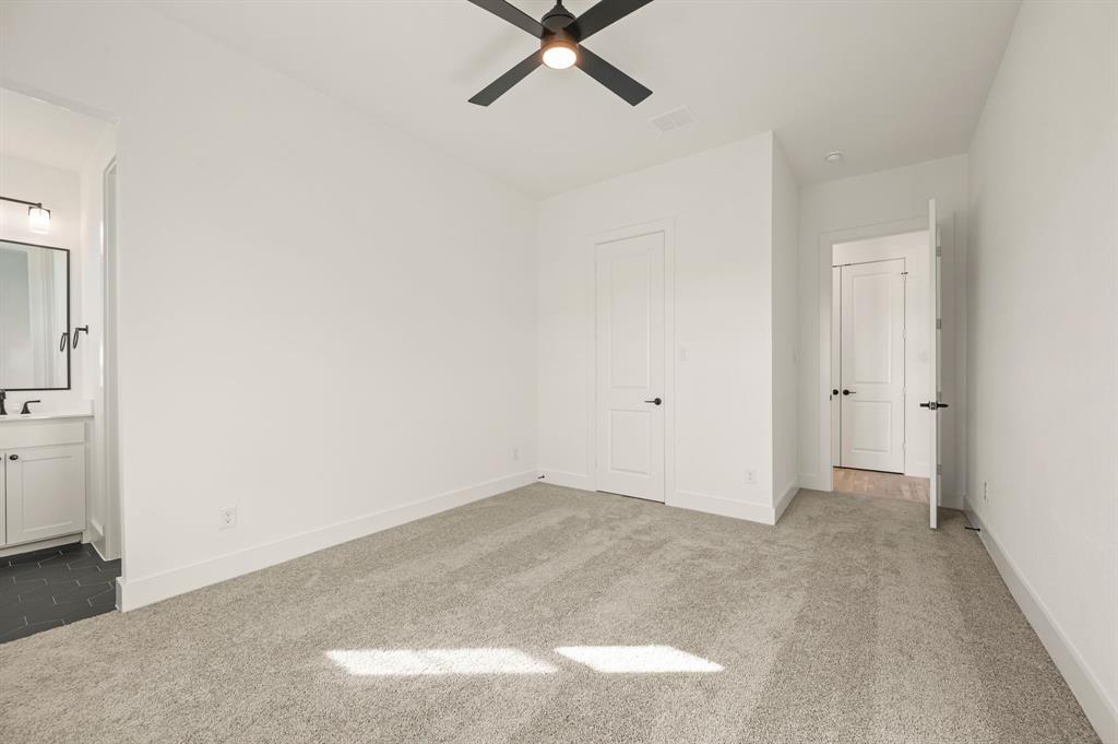 2139 Kingston Street Haslet, TX 76052 - Photo 28 of 40 an empty room with closet and fan