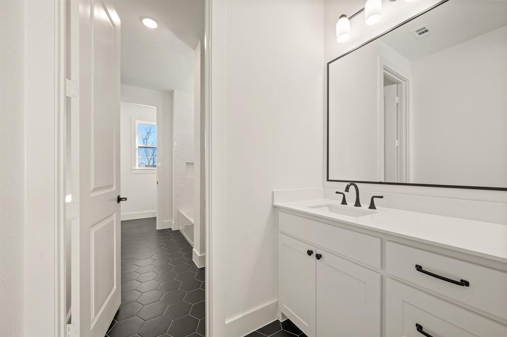 2139 Kingston Street Haslet, TX 76052 - Photo 30 of 40 a bathroom with a double vanity sink and mirror