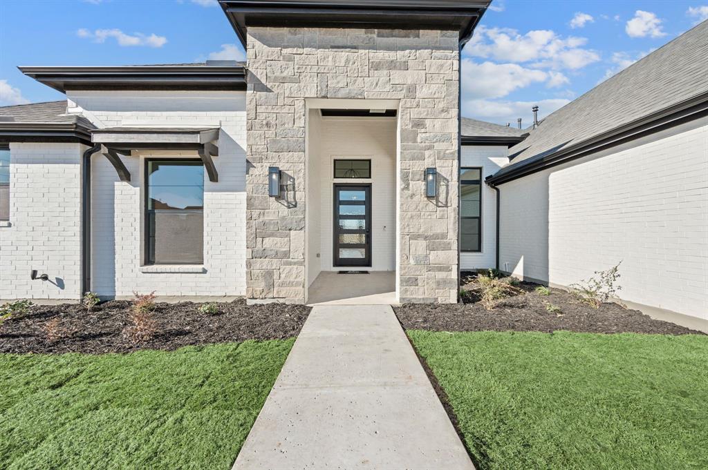 2139 Kingston Street Haslet, TX 76052 - Photo 3 of 40 a front view of a house with garden