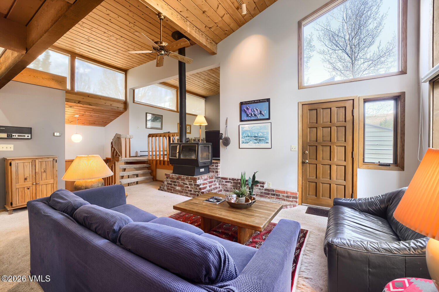 128 Beaver Road, Unit EAST Eagle-Vail, CO 81620 - Photo 1 of 21 a living room with furniture and a large window