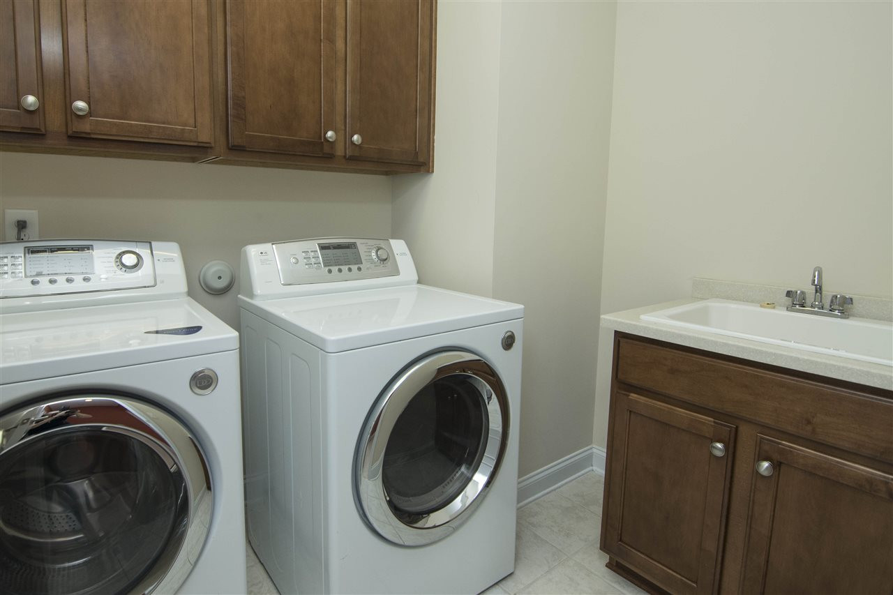 5305 Orabelle Court Raleigh, NC 27606 - Photo 26 of 30 Utility Room features sink and cabinets