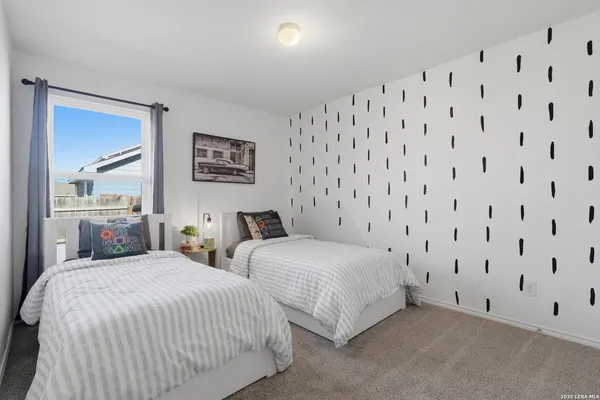 a bedroom with double bed and a lamp