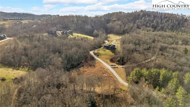 a view of a town with mountains in the background
