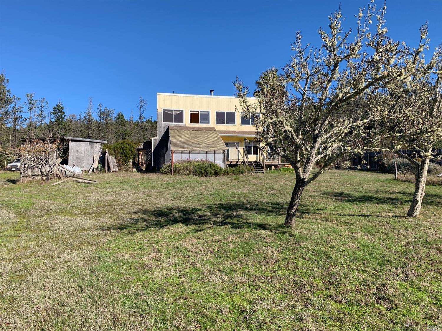 45891 Zettler Road Point Arena, CA 95468 - Photo 1 of 1 a view of a house with a yard
