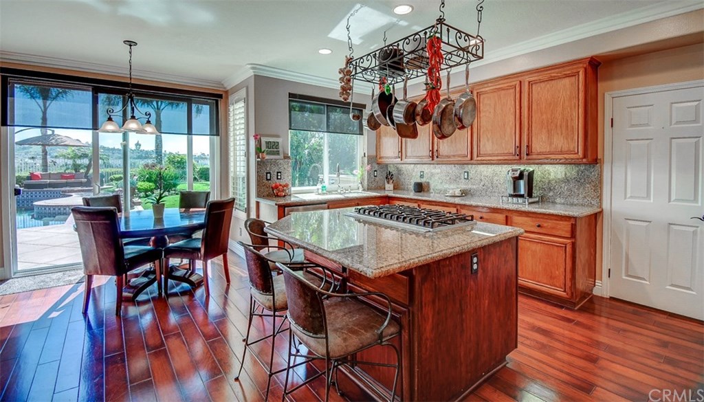 2 High Bluff Laguna Niguel, CA 92677 - Photo 11 of 37 a kitchen with a table chairs and wooden floors