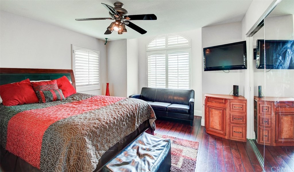 2 High Bluff Laguna Niguel, CA 92677 - Photo 18 of 37 a bedroom with a large bed and a flat screen tv