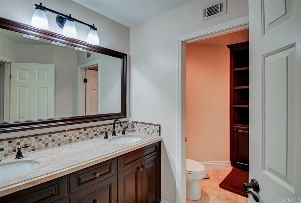 2 High Bluff Laguna Niguel, CA 92677 - Photo 19 of 37 a bathroom with a sink and a mirror