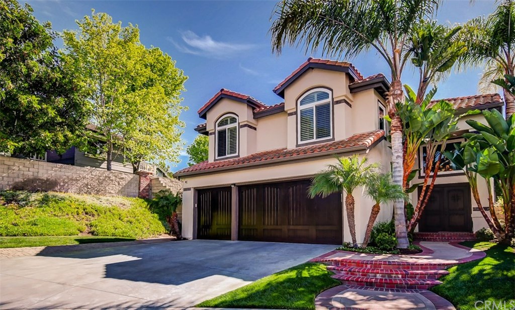 2 High Bluff Laguna Niguel, CA 92677 - Photo 2 of 37 a front view of a house with a garden