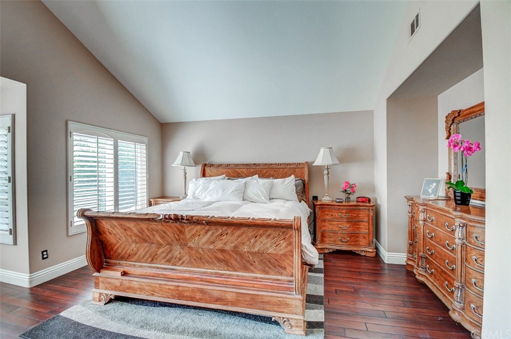 2 High Bluff Laguna Niguel, CA 92677 - Photo 24 of 37 a bedroom with a bed and wooden floor