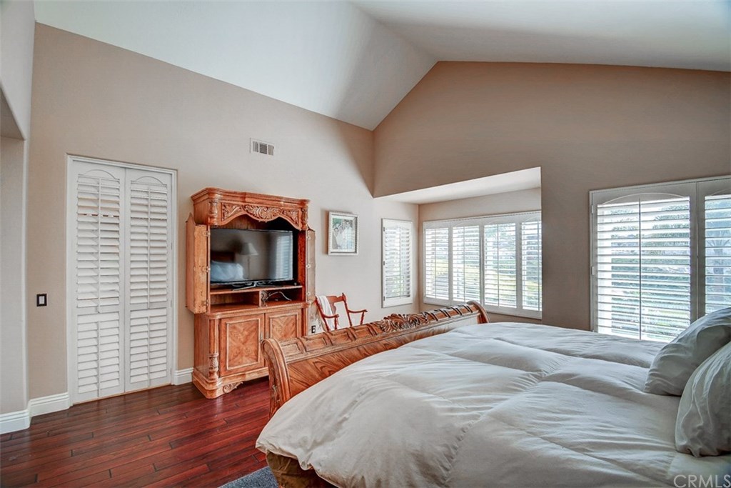 2 High Bluff Laguna Niguel, CA 92677 - Photo 26 of 37 a bedroom with a bed and a flat screen tv