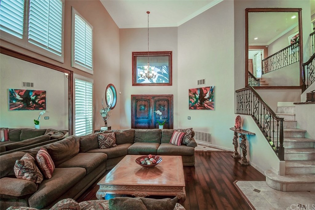 2 High Bluff Laguna Niguel, CA 92677 - Photo 3 of 37 a living room with furniture a fireplace and a large window