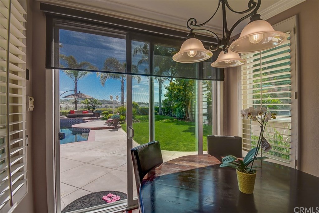2 High Bluff Laguna Niguel, CA 92677 - Photo 31 of 37 a view of a dining room with furniture wooden floor and chandelier