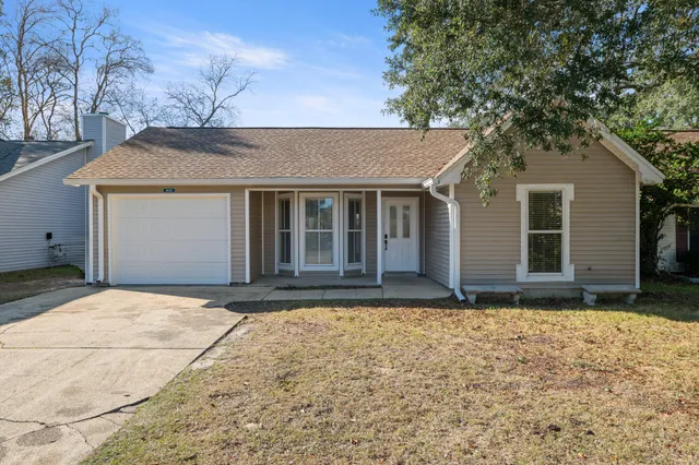 a house with yard in front of it