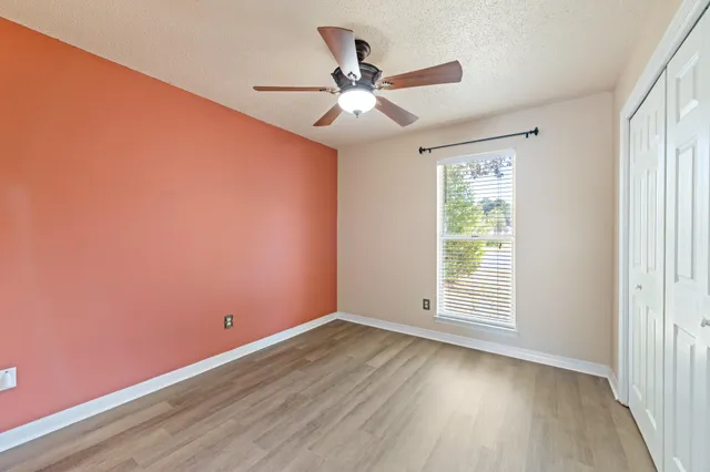 a white toilet sitting next to a bathroom sink and tub
