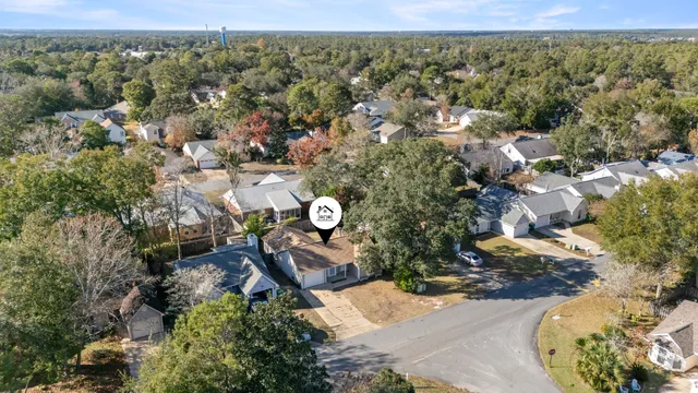 an aerial view of a house with outdoor space