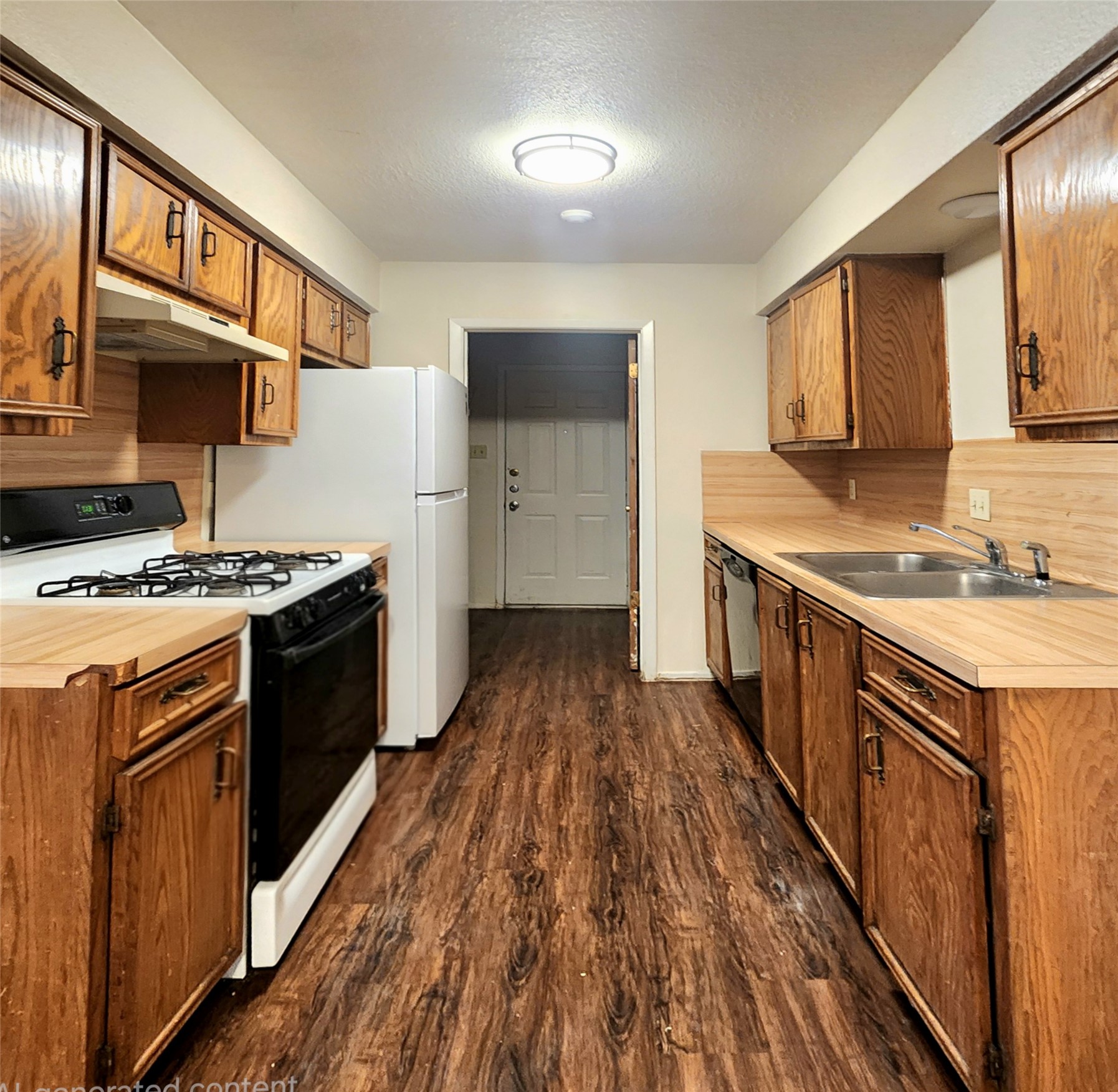 802 Kimberly Street, Unit A Georgetown, TX 78628 - Photo 2 of 7 Kitchen with gas stove, sink, dishwasher and fridge-door to laundry room