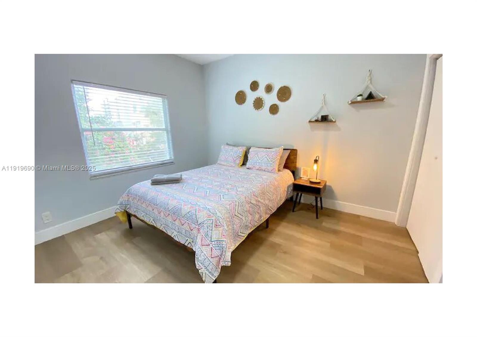 843-845 Northwest 3rd Street, Unit A Miami, FL 33128 - Photo 14 of 20 a bedroom with a bed and a window