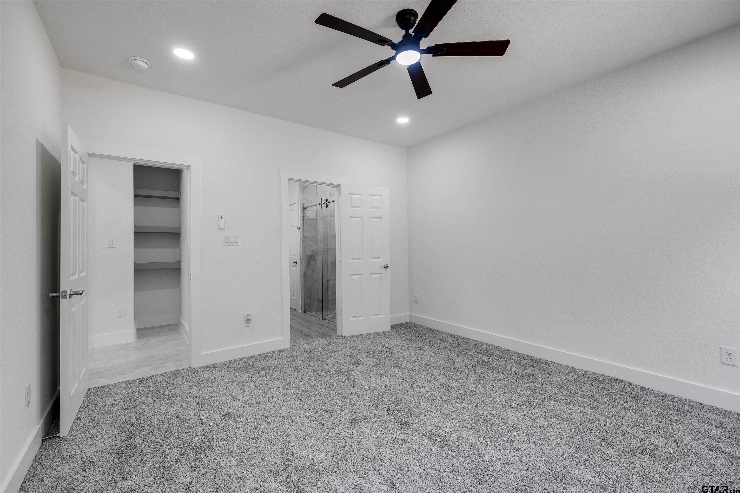 201 Victory Street Palestine, TX 75803 - Photo 16 of 37 an empty room with closet and a ceiling fan