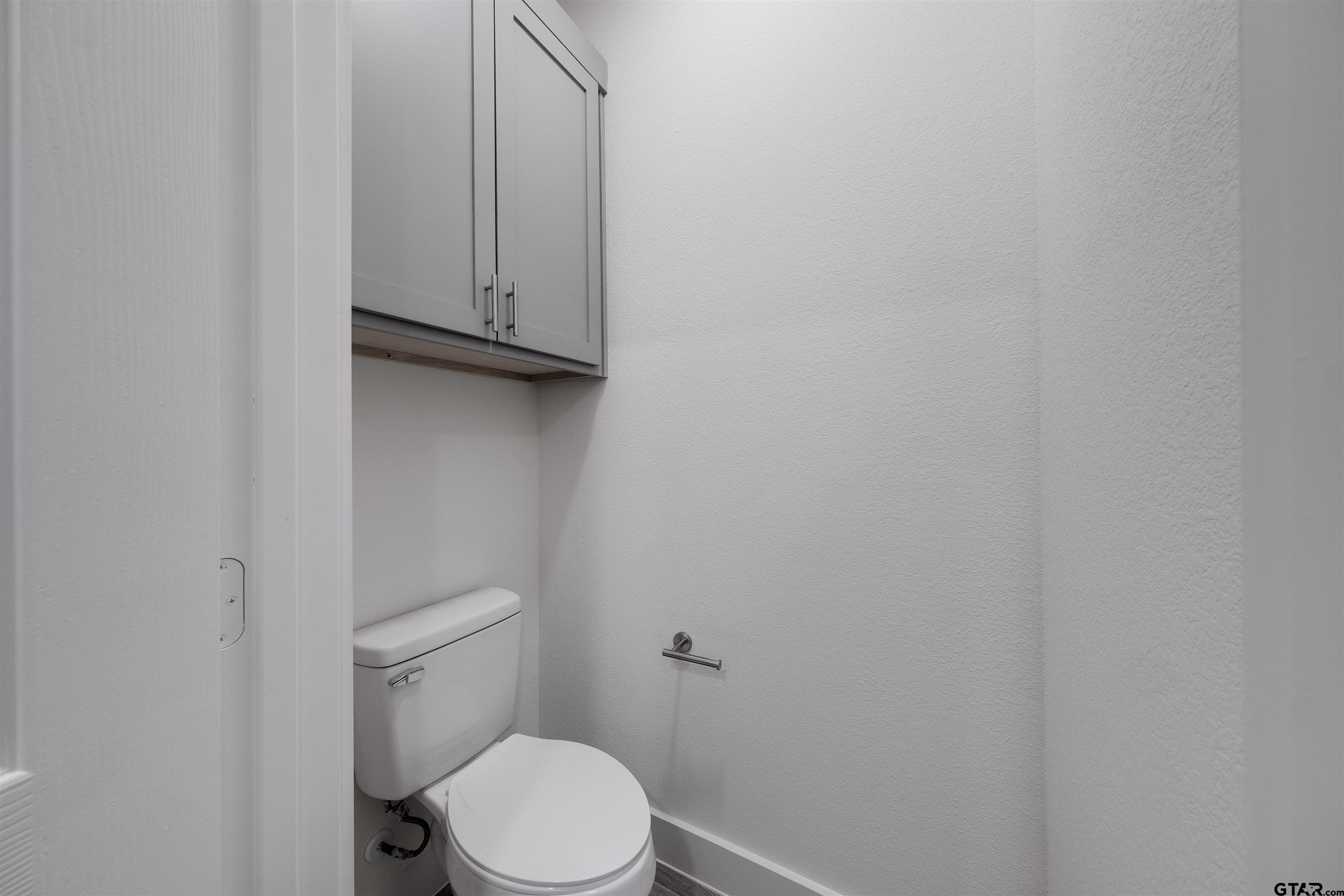 201 Victory Street Palestine, TX 75803 - Photo 21 of 37 a white toilet sitting next to a shower