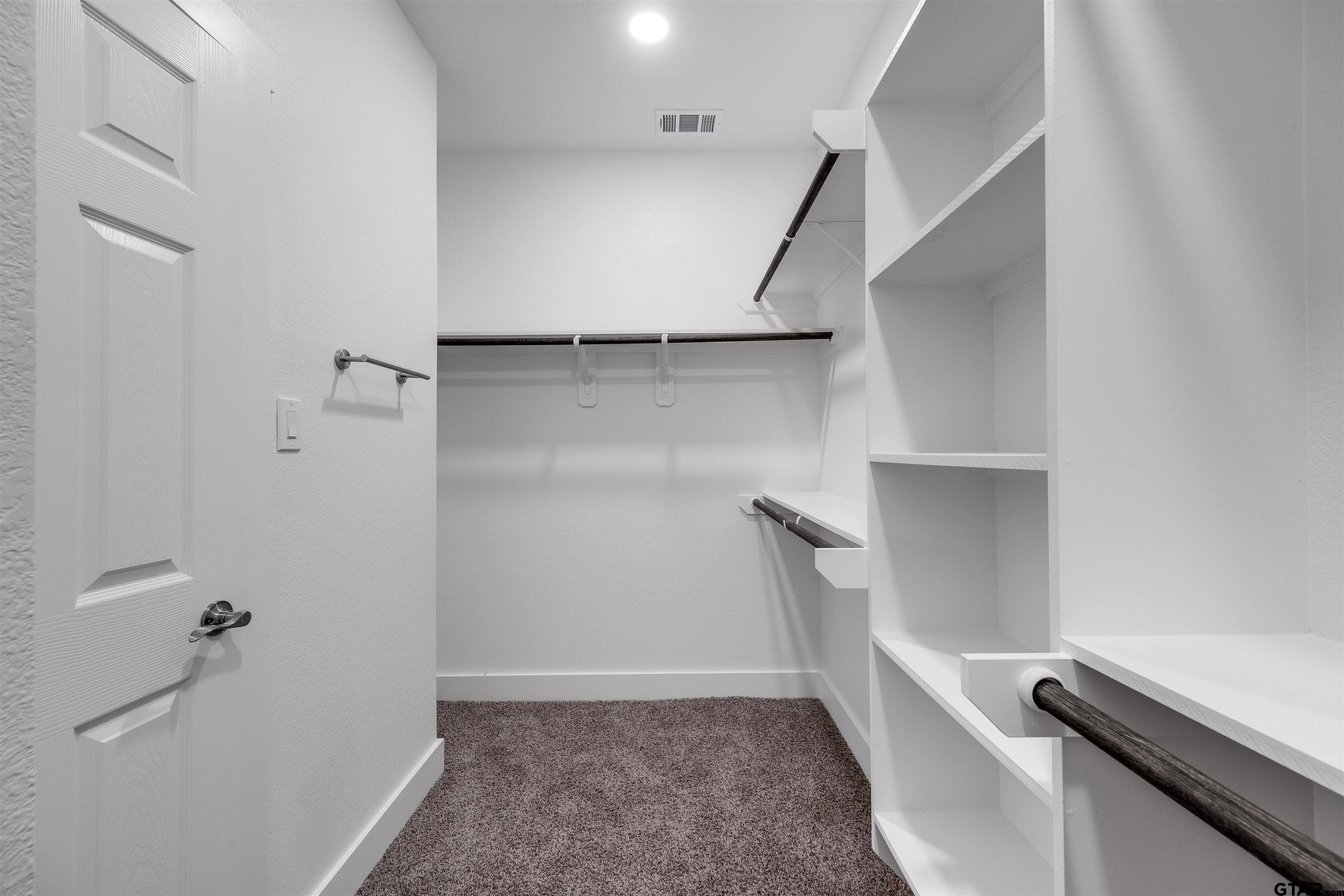 201 Victory Street Palestine, TX 75803 - Photo 22 of 37 a view of storage and utility room with racks on the wall